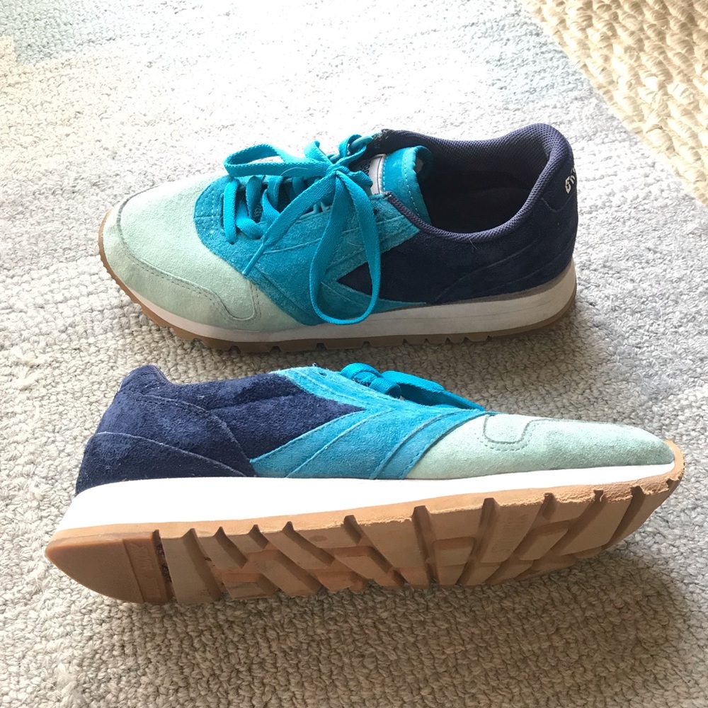 Aqua, navy, and royal blue colored Brooks shoes